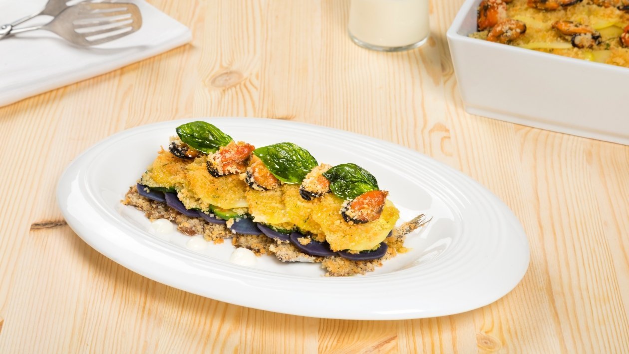 Millefoglie gratin di alici, cozze, zucchine e patate viola – - Ricetta
