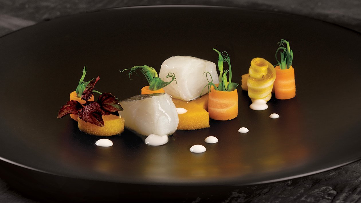 Baccalà cotto in olio cottura con pavè di zucca gialla e salsa al basilico