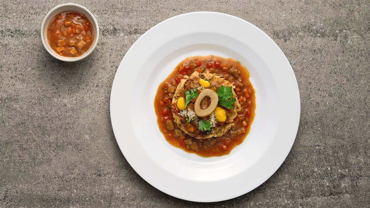 Frittatina di spaghetti saltati alla milanese con ragù di osso buco, crema di parmigiano allo zafferano e gremolada
