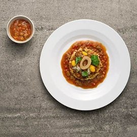 Frittatina di spaghetti saltati alla milanese con ragù di osso buco, crema di parmigiano allo zafferano e gremolada Frittatina di spaghetti saltati alla milanese con ragù di osso buco, crema di parmigiano allo zafferano e gremolada